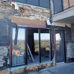 Home stripped of rotten materials and wet insulation.