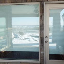 Exterior door and replacement window on home.