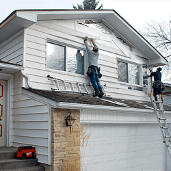 Old siding is removed from home.