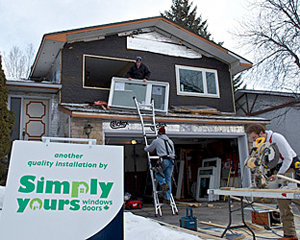 Simply Yours Windows and Doors installing a window