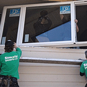 Installers Adding an Energy Efficient Window to a Home